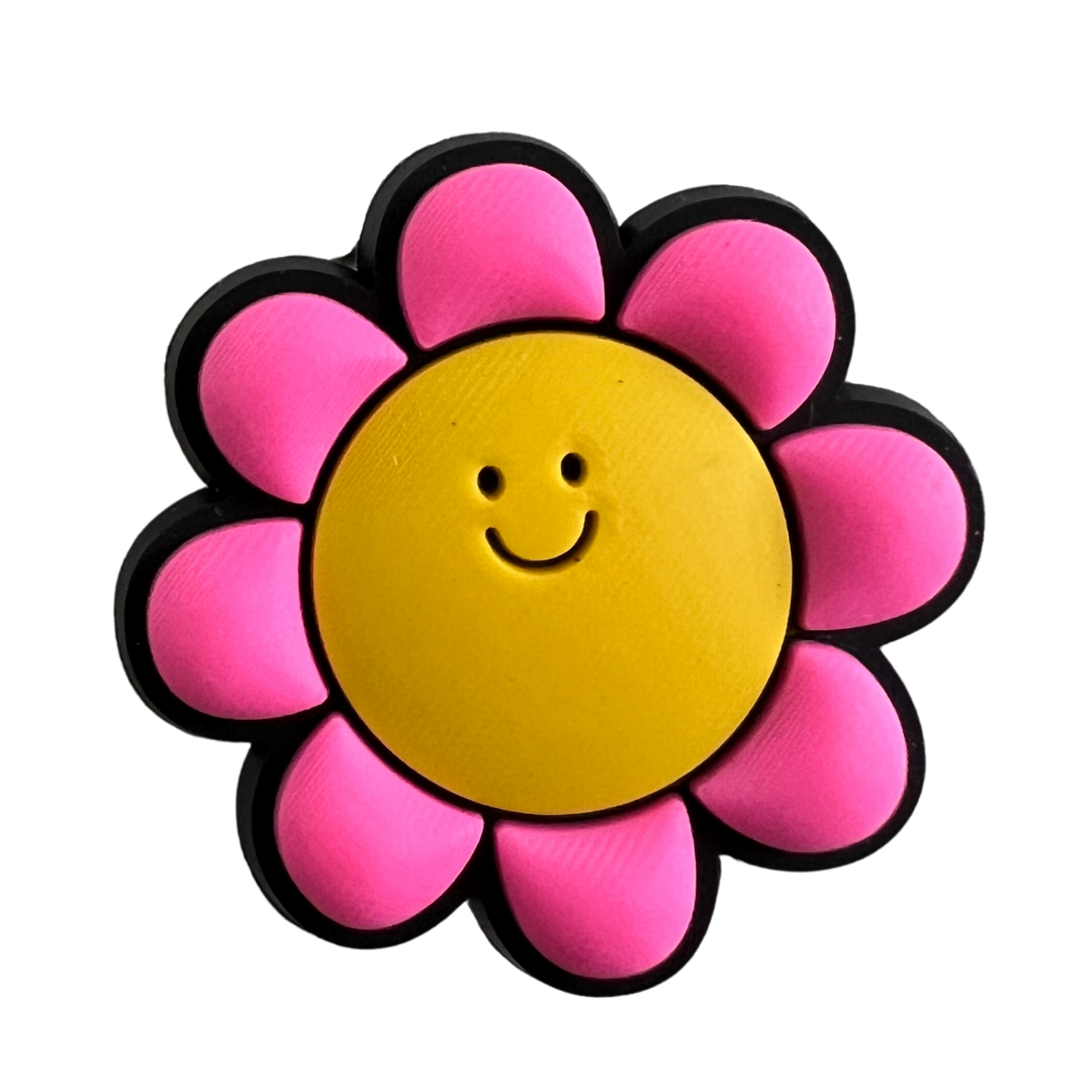 Pink flower with yellow smiley face