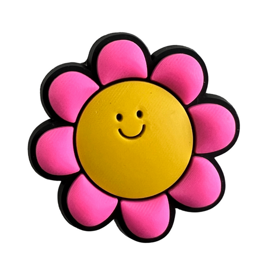 Pink flower with yellow smiley face